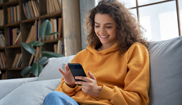 female holding cell phone