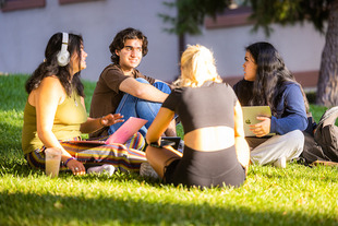 students sitting outside