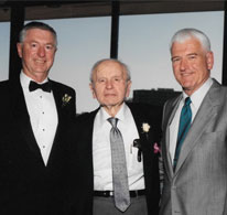 three men wearing suits