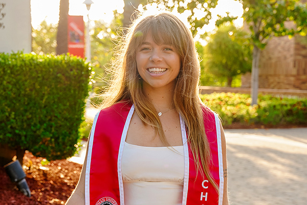 Young woman smiling outdoors