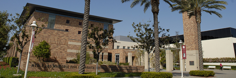 outside of the interfaith center on a sunny day with palm trees