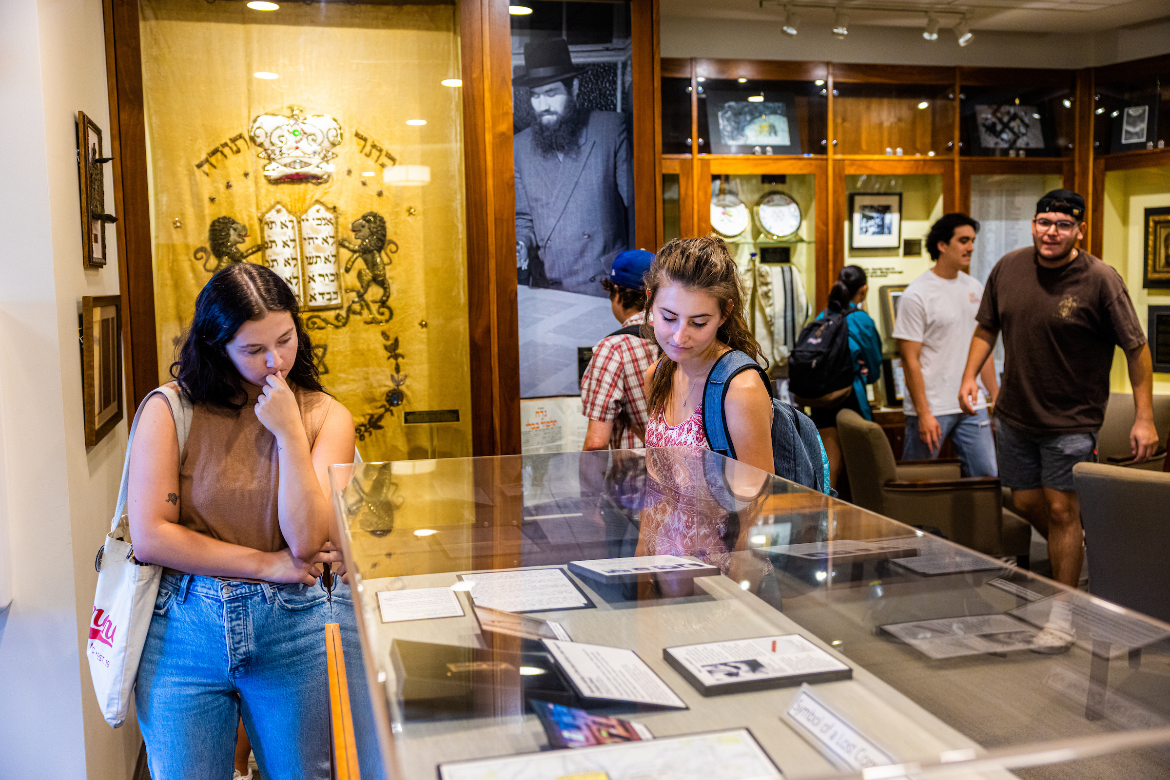 Students look at artifacts in museum