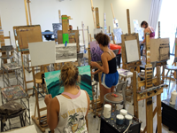 students painting at easels 