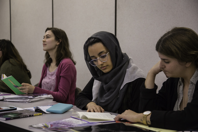 Wilkinson College students reading from poetry books